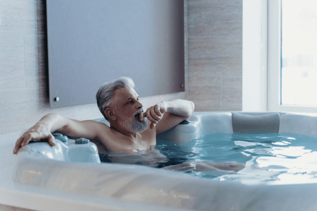 Homeowner relaxing in a hot tub supported by professionally installed electrical wiring and safety protection