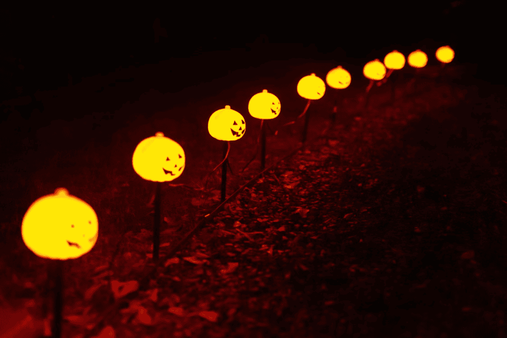 A residential pathway with Halloween lighting.