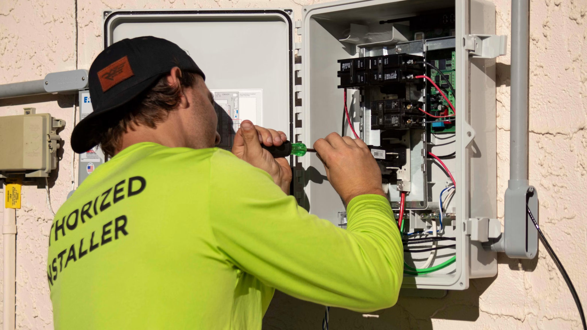  Electrician performing electrical panel maintenance to support safe and reliable power distribution.